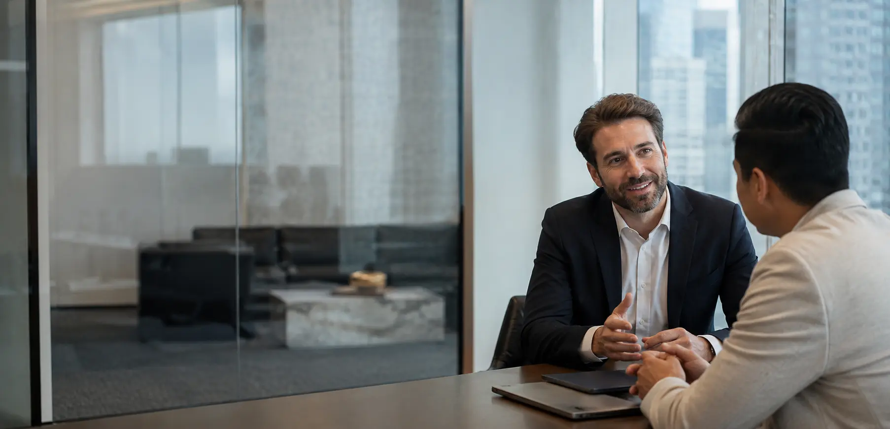A Westwind funding advisor speaking with a business owner in a modern office