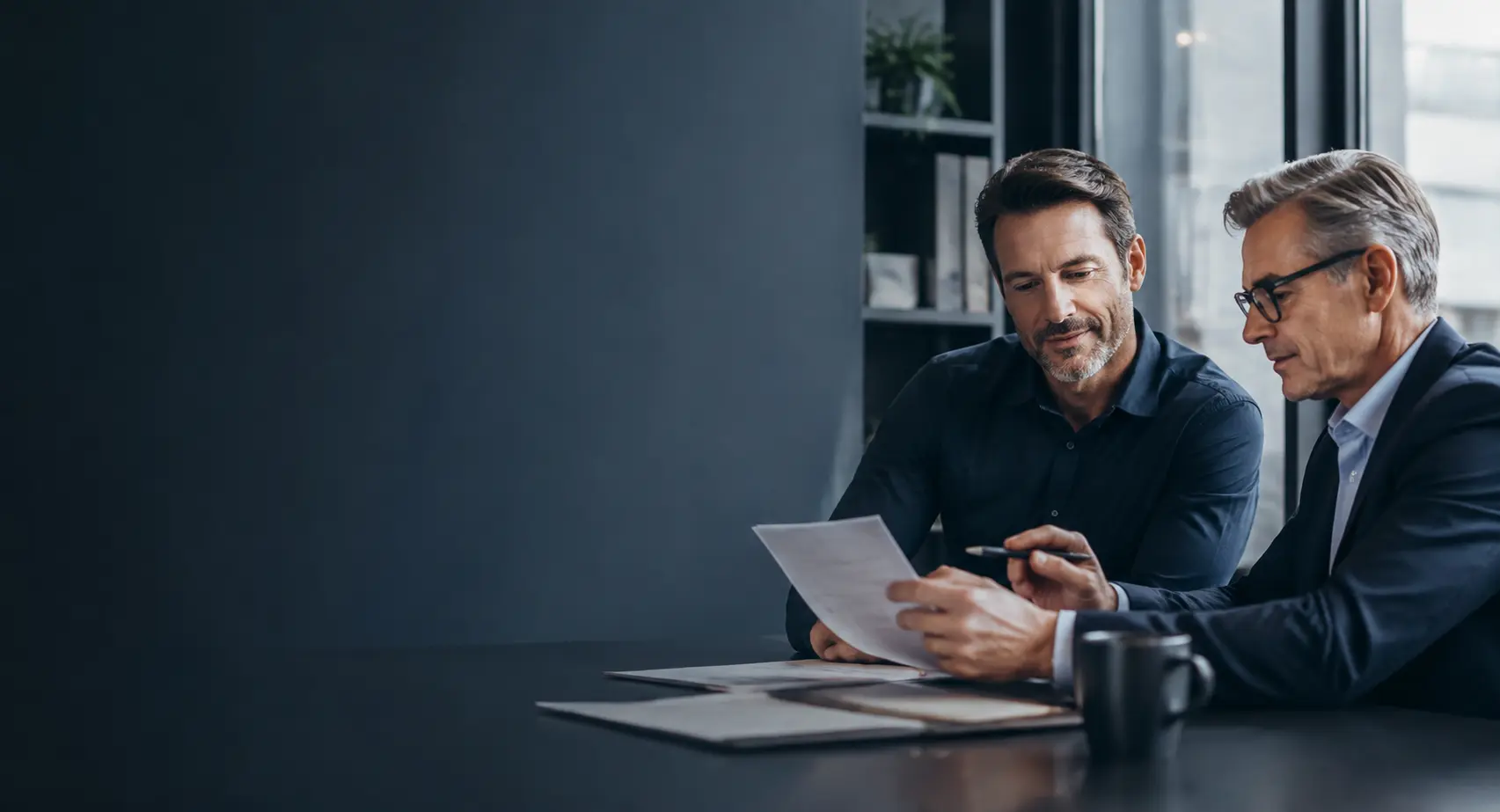 A business owner and financial advisor reviewing a manageable payment plan